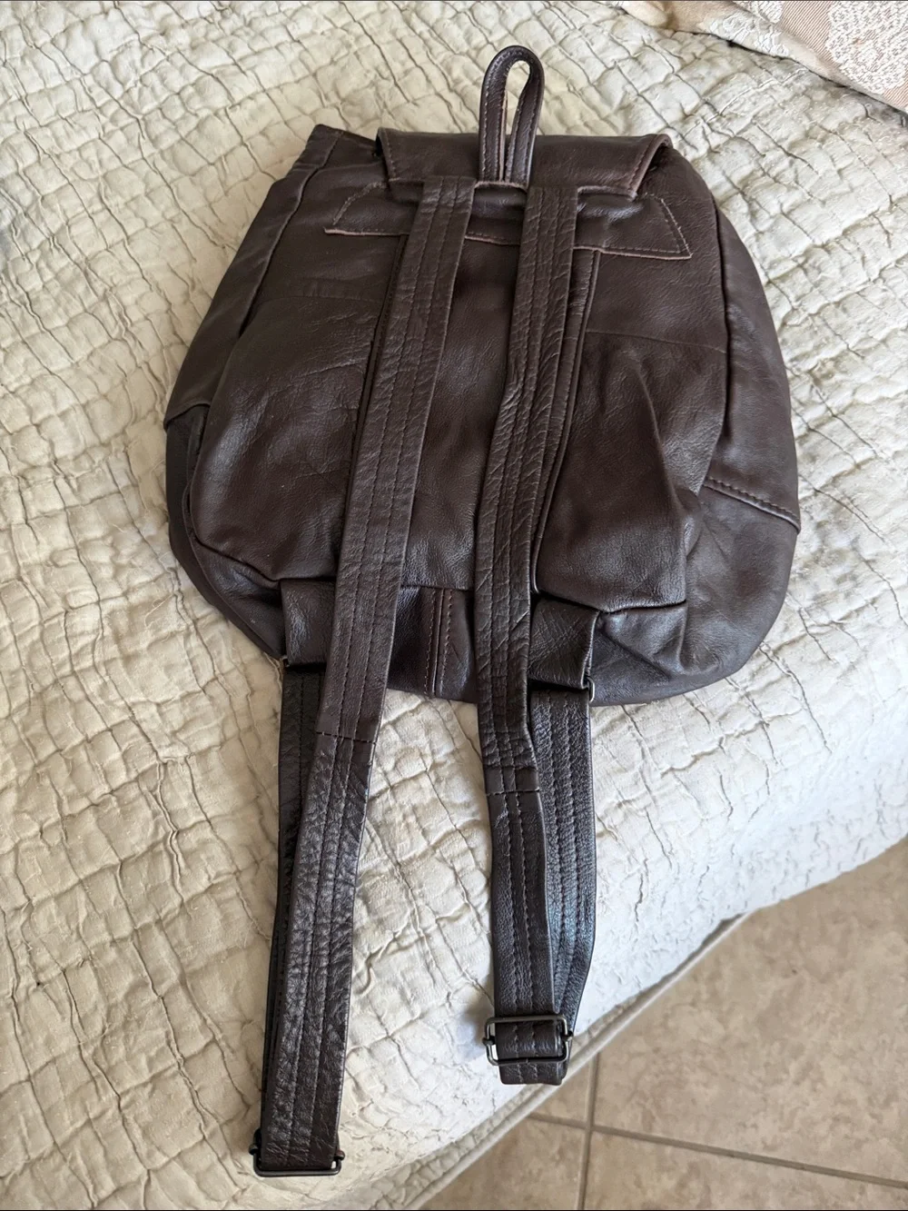 Men or women’s brown leather backpack in good condition supple clean interior